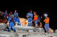 Rescue operations take place on a site after an earthquake struck the Aegean Sea, in the coastal province of Izmir