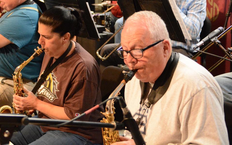 Saxophonist Marybeth Madziar, left, and Terry Hunt rehearse for the Tecumseh Players and TCA Big Band & VocalAires's presentation of the WTCA Radio Show, "A Christmas Carol," Saturday, Dec. 10, and Sunday, Dec. 11, at the Tecumseh Center for the Arts.