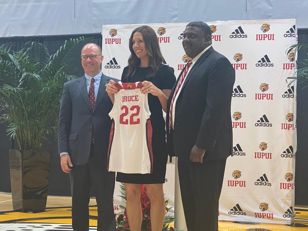 Kate Bruce (middle) was introduced Thursday as IUPUI's new women's basketball coach by interim chancellor Andrew Klein and athletic director Roderick Perry.