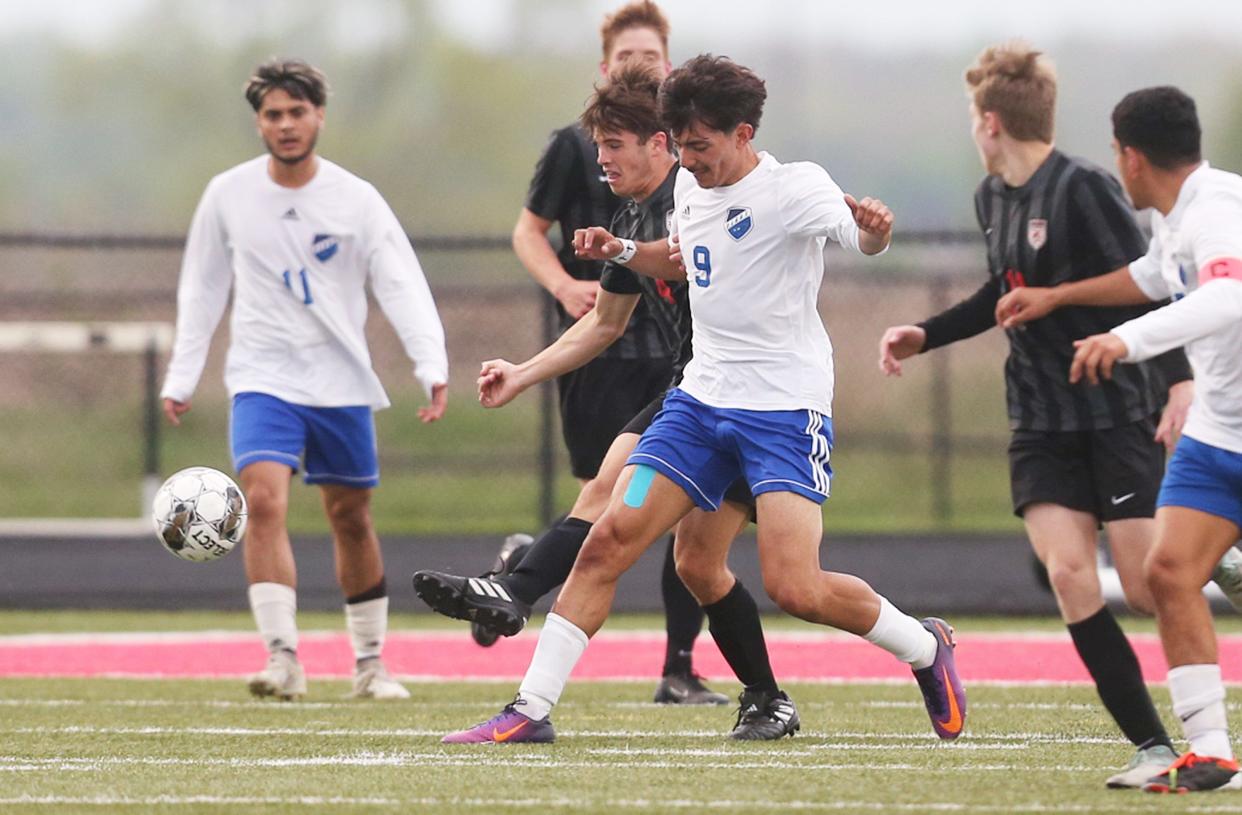 Perry’s Jonatan Banuelos and Gilbert’s Nash Hanson (4) battle for the ball during the first half at Tigers Stadium on Thursday, May 2, 2024, in Ames, Iowa.