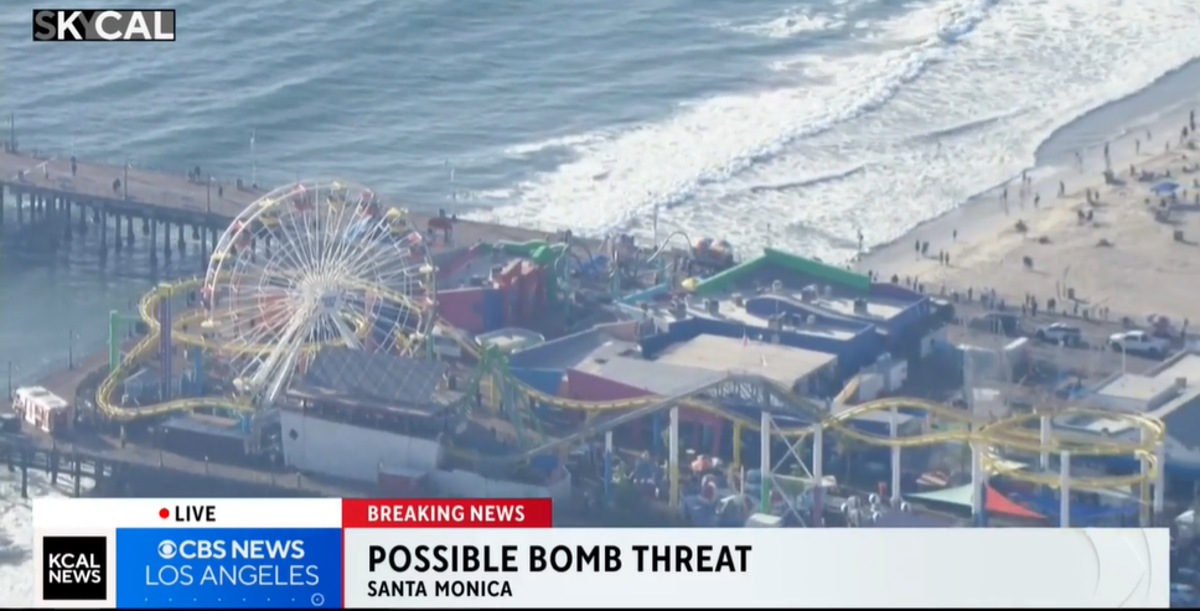 The Santa Monica Ferris wheel was evacuated after a man threatened to have a bomb as he climbed up the ride (KCAL News)
