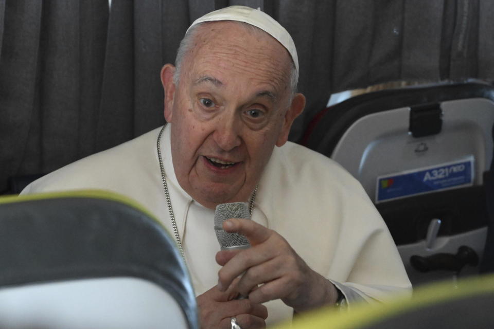 Pope Francis meets the journalists during a press conference aboard the airplane directed to Rome, at the end of the 37th World Youth Day in Lisbon, Sunday, Aug. 6, 2023. (Maurizio Brambatti/Pool Photo Via AP)