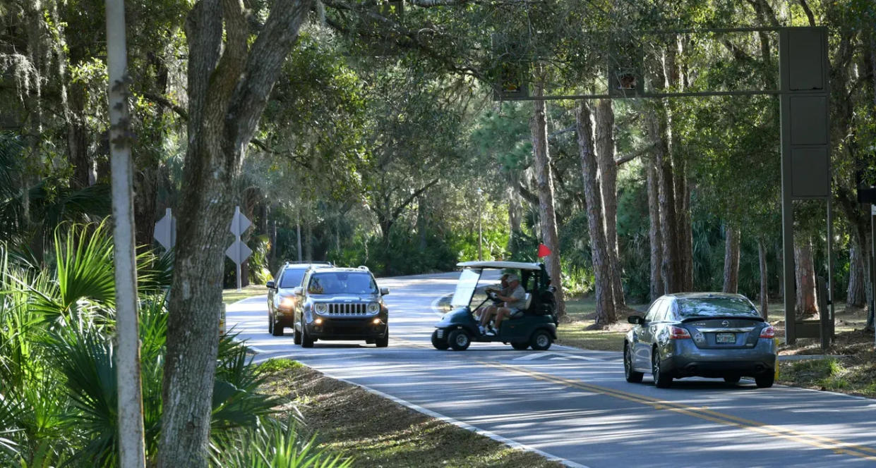 Vehicles give way for golf carts in the Meadows, a huge housing development on 17th Street, west of Interstate 75, in Sarasota.