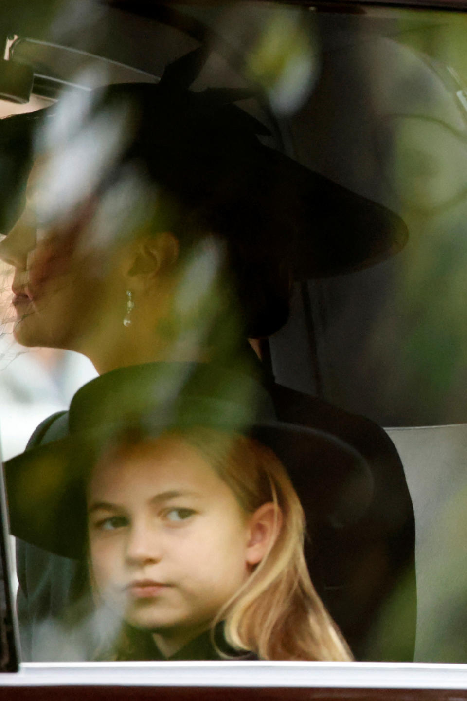 <p>Princess Charlotte sits in a car on her way to attend the State Funeral Service of Britain's Queen Elizabeth II on the Mall in central London Monday, Sept. 19, 2022. The Queen, who died aged 96 on Sept. 8, will be buried at Windsor alongside her late husband, Prince Philip, who died last year. David Cliff/Pool via REUTERS</p> 