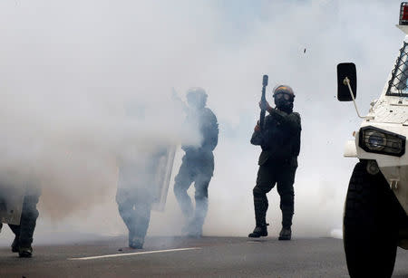 Riot police take position while clashing with opposition supporters rallying against President Nicolas Maduro in Caracas, Venezuela May 3, 2017. REUTERS/Carlos Garcia Rawlins