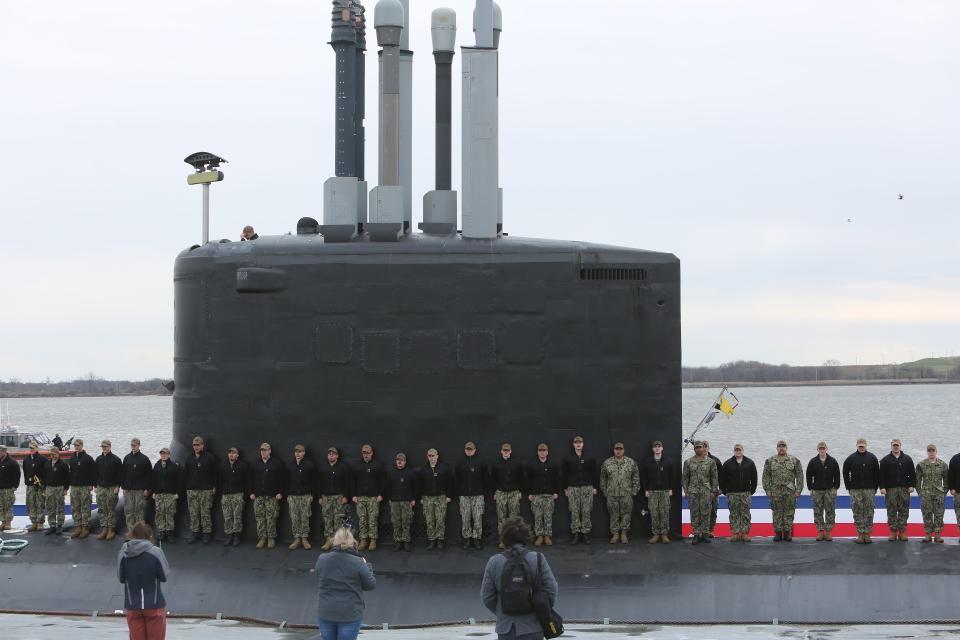The crew mans the rail of the USS Delaware at the Port of Wilmington on Friday, April 1, 2022. The group held a practice session ahead of the formal ceremony on April 2 to commemorate the submarine.