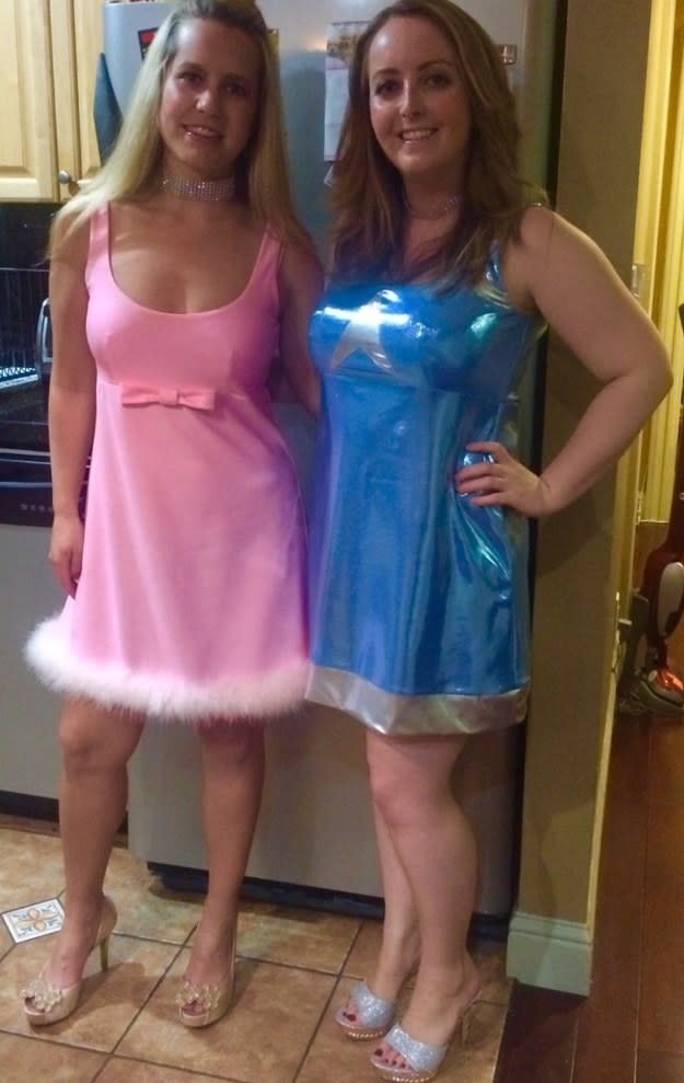 one girl in a pink dress and one in a blue dress