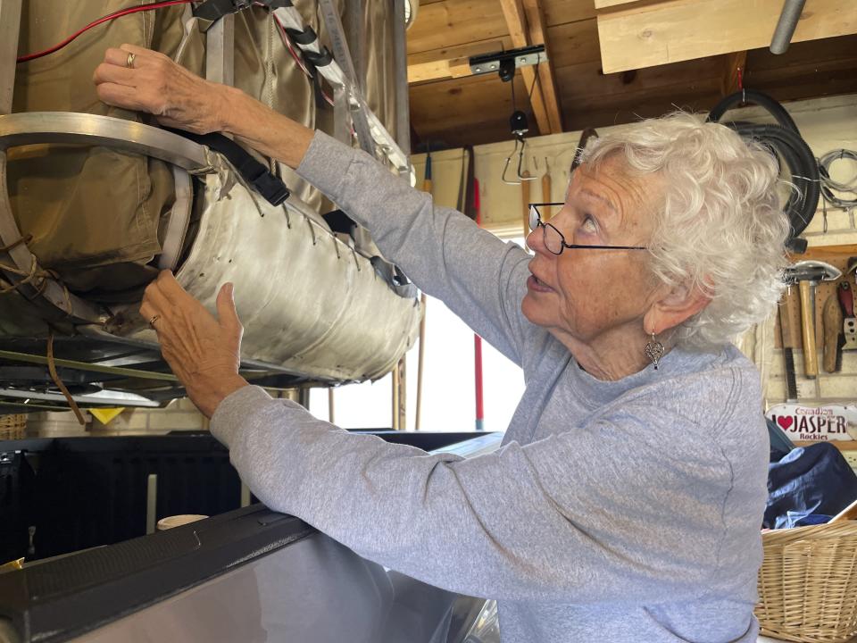 Pilot Barbara Fricke checks attachments on her balloon basket, during an interview Sept. 21, 2023, in Albuquerque, N.M. It's been 15 years since the world's elite gas balloon pilots have gathered in the United States for the Coupe Gordon Bennett, a long-distance race whose roots stretch back more than a century. Fricke and her husband, Peter Cuneo, will participate in the 2023 Gordon Bennett competition. The flight window opens Saturday, Oct. 7. (AP Photo/Susan Montoya Bryan)