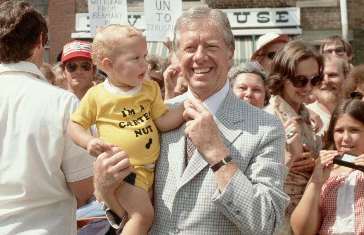 President Jimmy Carter poses with a baby in Quincy, Illinois, in 1979. Last year,&nbsp;9,753 boys and 598 girls were named Carter.&nbsp; (Photo: Wally McNamee via Getty Images)