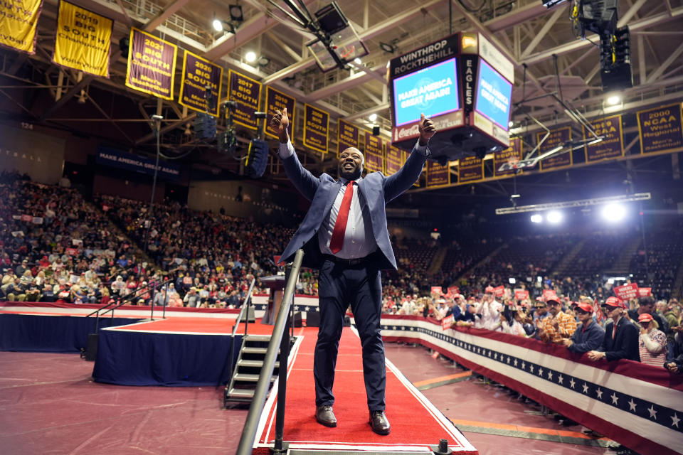 Sen. Tim Scott, R-S.C., waves before Republican presidential candidate former President Donald Trump speaks at a campaign rally Friday, Feb. 23, 2024, in Rock Hill, S.C. (AP Photo/Chris Carlson)
