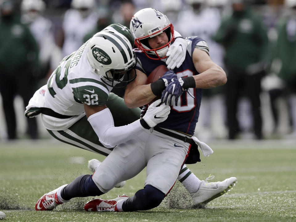 <p>New York Jets cornerback Juston Burris (32) tackles New England Patriots wide receiver Danny Amendola after a reception in the first half of an NFL football game, Sunday, Dec. 31, 2017, in Foxborough, Mass. (AP Photo/Charles Krupa) </p>