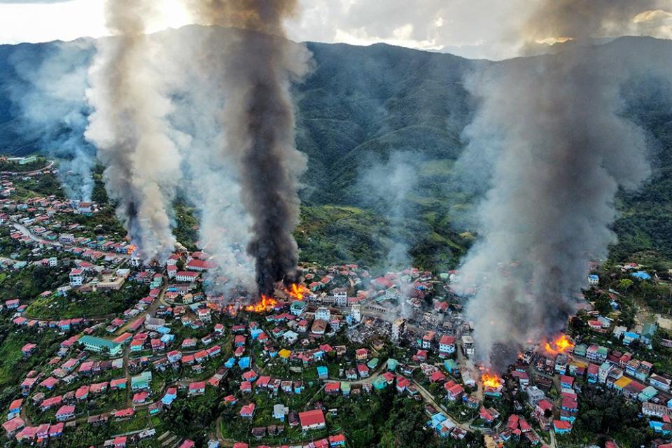 this aerial photo taken on October 29, 2021 show smokes and fires from Thantlang, in Chin State, where more than 160 buildings have been destroyed caused by shelling from Junta military troops, according to local media.