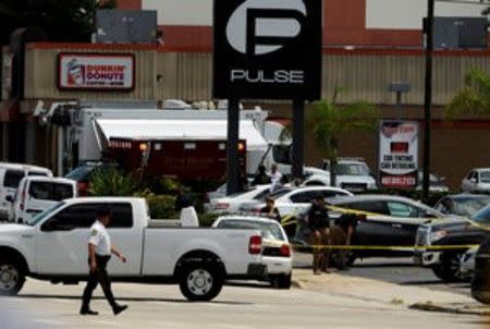 Police continue to investigate a shooting at the Pulse night club following an early morning shooting attack in Orlando, Florida, U.S June 12, 2016. REUTERS/Steve Nesius