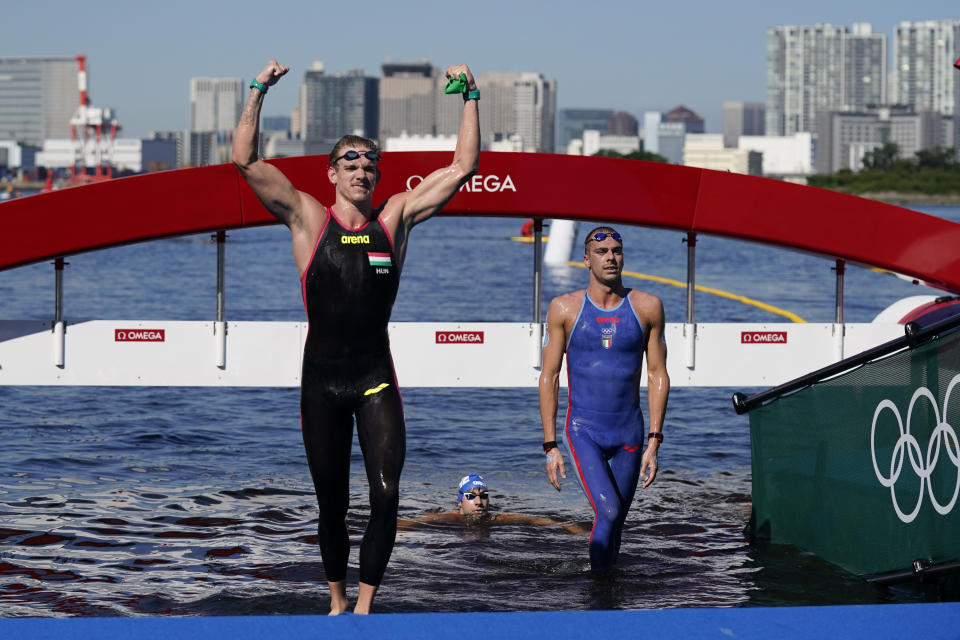 Silver medalist Kristof Rasovszky, left, of Hungary, bronze medalist Gregorio Paltrinieri, of Italy, walks out of the water after the men's marathon swimming event at the 2020 Summer Olympics, Thursday, Aug. 5, 2021, in Tokyo, Japan. (AP Photo/Jae C. Hong)