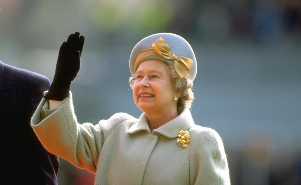 A photo of Queen Elizabeth II waving.