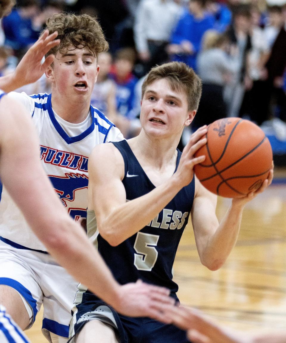 Fairless High School’s Brody Pumneo is guarded by Tuslaw’s Troy Harbeitner on Friday, Jan. 7, 2022.