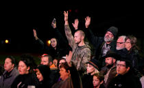 <p>Families of victims in the First Baptist Church of Sutherland Springs shooting pray at a prayer vigil in Floresville, Texas, Nov. 8, 2017. (Photo: Rick Wilking/Reuters) </p>