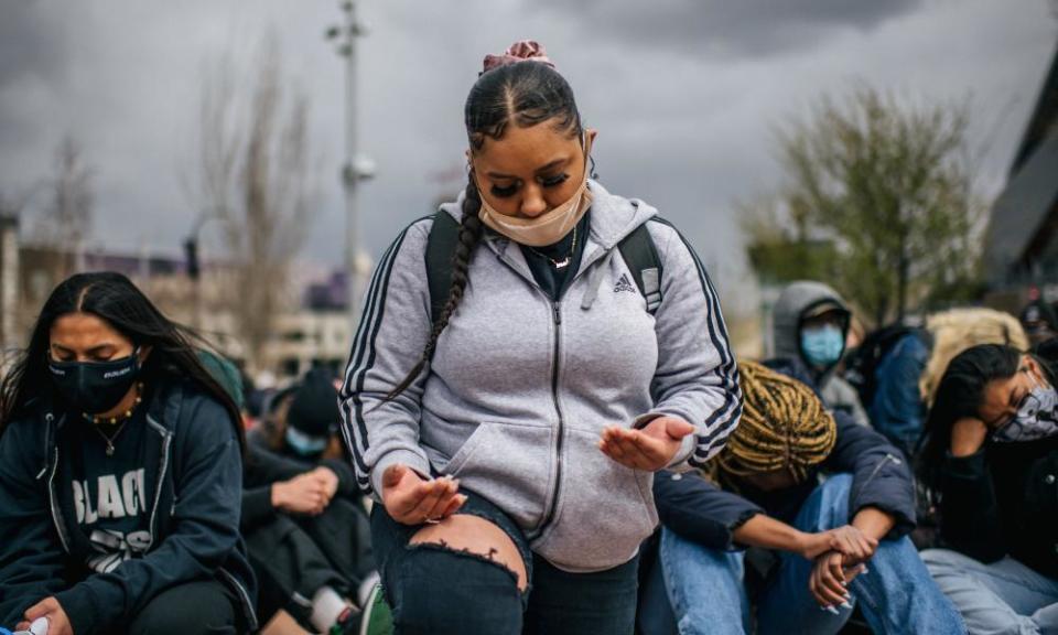 High school students from across Minneapolis sit in silence during the demonstration.