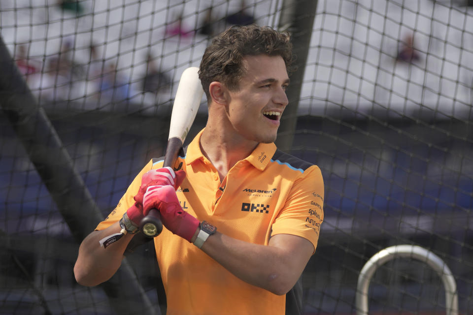 Lando Norris Formula One driver for Mclaren smiles during St. Louis Cardinals' training session ahead of the baseball match against Chicago Cubs at the MLB World Tour London Series, in London Stadium. (AP Photo/Kin Cheung)