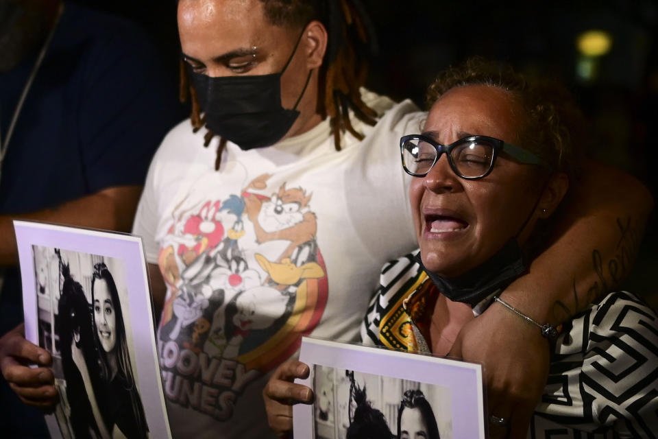 Keila Ortiz, the mother of Keishla Rodriguez, cries out for justice after boxer Felix Verdejo was arrested in connection with the death of her 27-year-old pregnant daughter whose body was found in a lagoon, outside FBI headquarters in San Juan, Puerto Rico, Sunday, May 2, 2021. (AP Photo/Carlos Giusti)