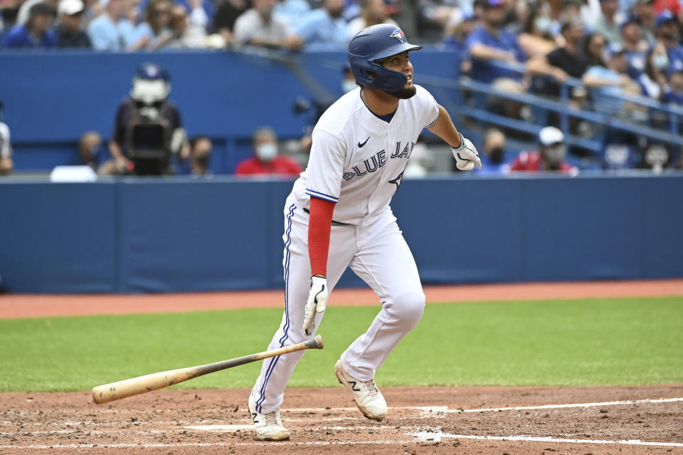 Toronto Blue Jays' Breyvic Valera watches his two-run home run in the fourth inning of a baseball game against the Oakland Athletics in Toronto on Saturday, Sept. 4, 2021. (Jon Blacker/The Canadian Press via AP)