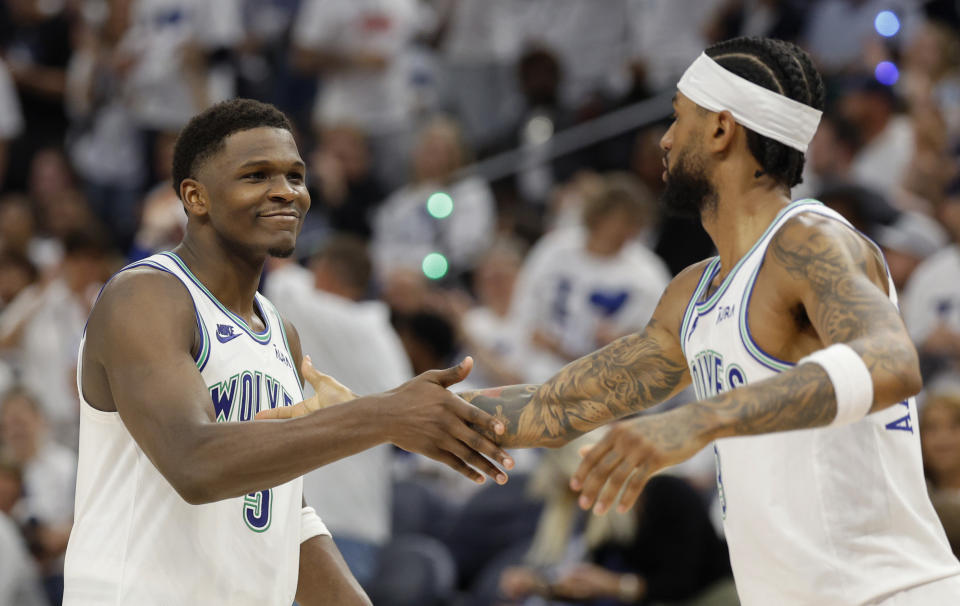 MINNEAPOLIS, MINNESOTA - MAY 16: Anthony Edwards #5 of the Minnesota Timberwolves and Nickeil Alexander-Walker #9 of the Minnesota Timberwolves celebrate against the Denver Nuggets during the fourth quarter in Game Six of the Western Conference Second Round Playoffs at Target Center on May 16, 2024 in Minneapolis, Minnesota. NOTE TO USER: User expressly acknowledges and agrees that, by downloading and or using this photograph, User is consenting to the terms and conditions of the Getty Images License Agreement. (Photo by David Berding/Getty Images)