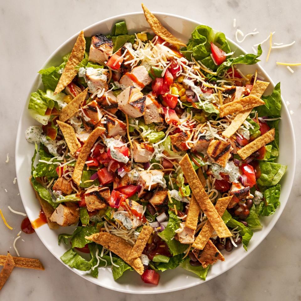 <p>Some salads are meant to be <a href="https://www.delish.com/cooking/g1970/side-dishes/" rel="nofollow noopener" target="_blank" data-ylk="slk:sides;elm:context_link;itc:0;sec:content-canvas" class="link ">sides</a>, but some (the best ones!) can stand as a <a href="https://www.delish.com/cooking/nutrition/g2599/healthy-dinner-salads/" rel="nofollow noopener" target="_blank" data-ylk="slk:dinner;elm:context_link;itc:0;sec:content-canvas" class="link ">dinner</a> all on their own. This BBQ chicken salad is firmly in the latter camp: Juicy <a href="https://www.delish.com/cooking/recipe-ideas/recipes/a47360/bbq-grilled-chicken-recipe/" rel="nofollow noopener" target="_blank" data-ylk="slk:grilled BBQ chicken;elm:context_link;itc:0;sec:content-canvas" class="link ">grilled BBQ chicken</a> sits alongside festive South-of-the-border-inspired toppings like <a href="https://www.delish.com/cooking/recipe-ideas/g4252/best-black-bean-recipes/" rel="nofollow noopener" target="_blank" data-ylk="slk:black beans;elm:context_link;itc:0;sec:content-canvas" class="link ">black beans</a>, <a href="https://www.delish.com/cooking/g1463/sweet-corn-recipes/" rel="nofollow noopener" target="_blank" data-ylk="slk:corn;elm:context_link;itc:0;sec:content-canvas" class="link ">corn</a>, cheese, and tortilla strips. Put that on top of some crunchy romaine and drizzle it with <a href="https://www.delish.com/cooking/g257/barbecue-sauce-recipes/" rel="nofollow noopener" target="_blank" data-ylk="slk:BBQ sauce;elm:context_link;itc:0;sec:content-canvas" class="link ">BBQ sauce</a> and ranch <a href="https://www.delish.com/cooking/g40189579/salad-dressing-recipes/" rel="nofollow noopener" target="_blank" data-ylk="slk:dressing;elm:context_link;itc:0;sec:content-canvas" class="link ">dressing</a>, and you’ve got yourself a hearty meal you’ll look forward to eating again and again.</p><p>Get the <strong><a href="https://www.delish.com/cooking/recipe-ideas/a43031875/bbq-chicken-salad-recipe/" rel="nofollow noopener" target="_blank" data-ylk="slk:BBQ Chicken Salad recipe;elm:context_link;itc:0;sec:content-canvas" class="link ">BBQ Chicken Salad recipe</a></strong>. </p>