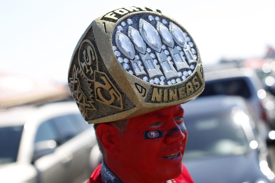 A football fan wears a ring-shaped hat during before the NFL season home opener football game between the San Francisco 49ers and the Green Bay Packers in San Francisco