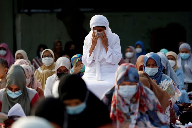 FILE PHOTO: Indonesian Muslims pray at the Great Mosque of Al Azhar during Eid al-Fitr in Jakarta