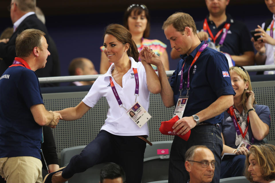 Kate was helped to her seat by Prince William, Duke of Cambridge and Andy Hunt, Chef de Mission for Great Britain as they watch the track cycling at the London 2012 Olympic Games (Photo by Bryn Lennon/Getty Images)