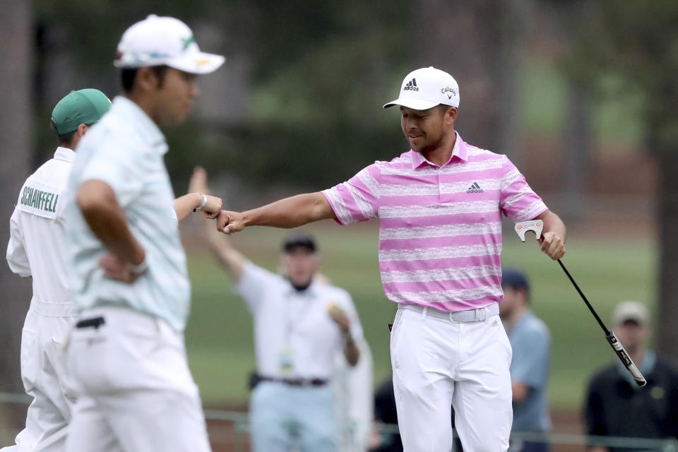 Xander Schauffele reacts to his eagle putt on the 15h hole during the third round of the Masters golf tournament at Augusta National, Saturday, April 10, 2021, in Augusta, Ga. (Curtis Compton/Atlanta Journal-Constitution via AP)