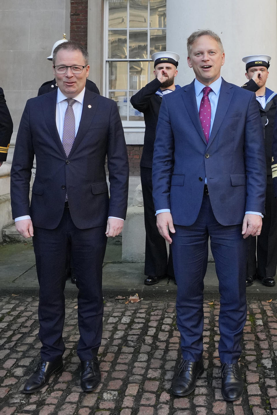 Britain's Defence Secretary Grant Shapps, right, smiles with Norway's Minister of Defence Bjorn Arild Gram during a meeting , in London, Monday, Dec. 11, 2023. Britain's Ministry of Defense is transferring two minehunting ships to Ukraine as part of a package of long-term support to bolster security in the Black Sea. The transfer comes as Britain and Norway announce plans for a new maritime coalition to increase support for Ukraine in the war with Russia. (AP Photo/Kirsty Wigglesworth)