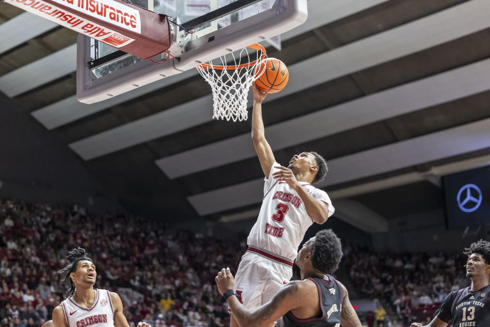 Alabama guard Rylan Griffen (3) gets loose for a basket and draws a foul against Texas A&M during the first half of an NCAA college basketball game, Saturday, Feb. 17, 2024, in Tuscaloosa, Ala. (AP Photo/Vasha Hunt)