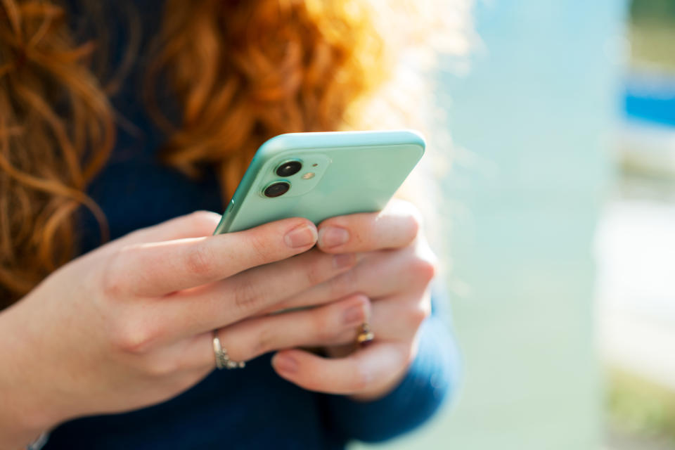 hands typing on a smarthphone