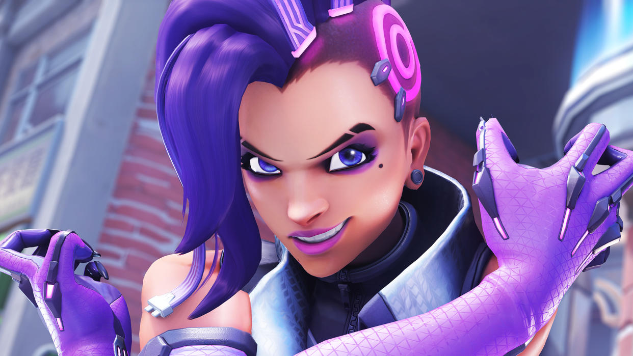  Overwatch 2's Sombra looks toward camera with arms crossed. 