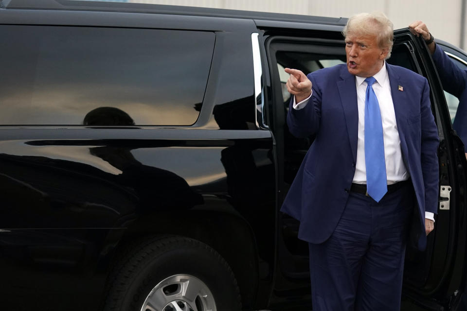 Republican presidential candidate former President Donald Trump gestures as he prepares to depart Manchester-Boston Regional Airport, Monday Oct. 23, 2023, in Londonderry, N.H. (AP Photo/Charles Krupa)