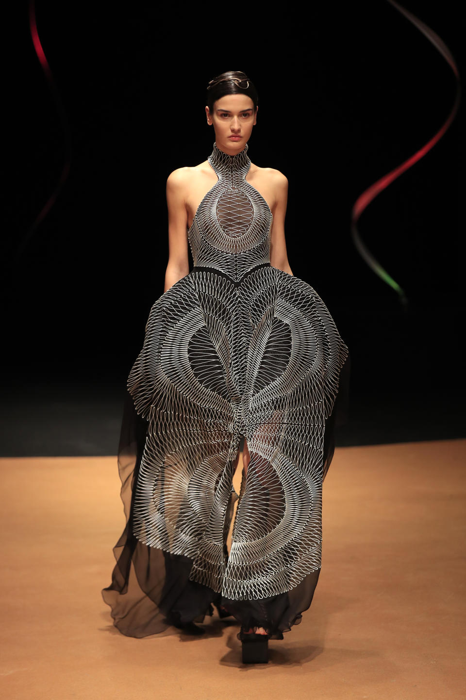 A model wears a creation for Iris van Herpen Haute Couture Spring/Summer 2020 fashion collection presented Monday Jan.20, 2020 in Paris (AP Photo/Michel Euler)