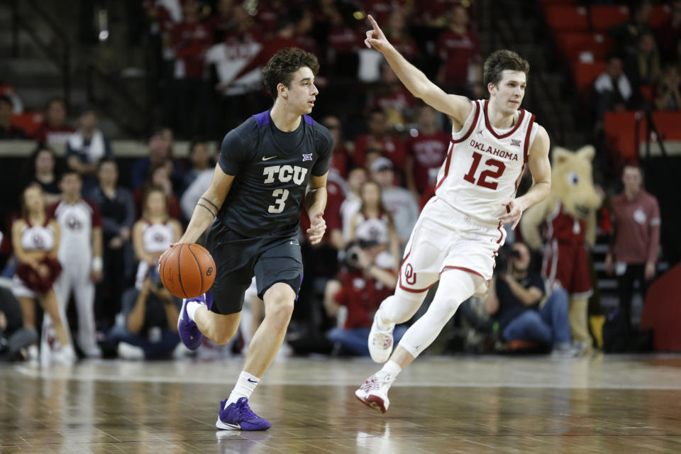 TCU's Francisco Farabello (3) drives the ball away from Oklahoma's Austin Reaves (12) during the first half of an NCAA college basketball game in Norman, Okla., Saturday, Jan. 18, 2020. (AP Photo/Garett Fisbeck)