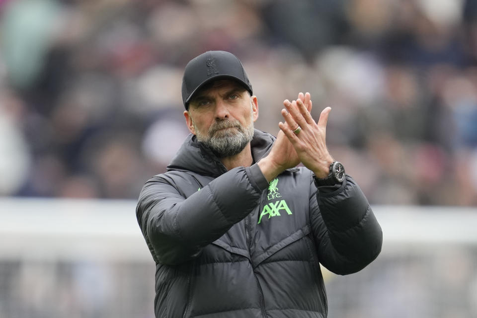 Liverpool's manager Jurgen Klopp applauds at the end of the English Premier League soccer match between West Ham United and Liverpool at London stadium in London, Saturday, April 27, 2024. The match ended in a 2-2 draw. (AP Photo/Kin Cheung)
