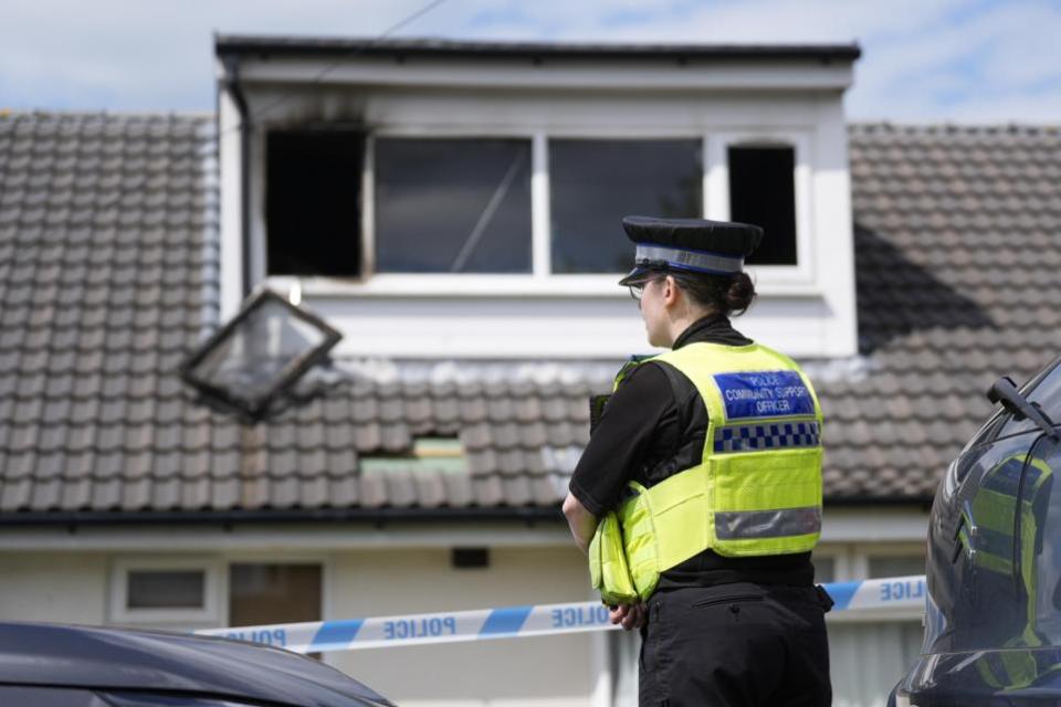 Bradford Telegraph and Argus: A police officer at the scene of a fatal house fire in Bradford, where one child has died and four other people were taken to hospital.