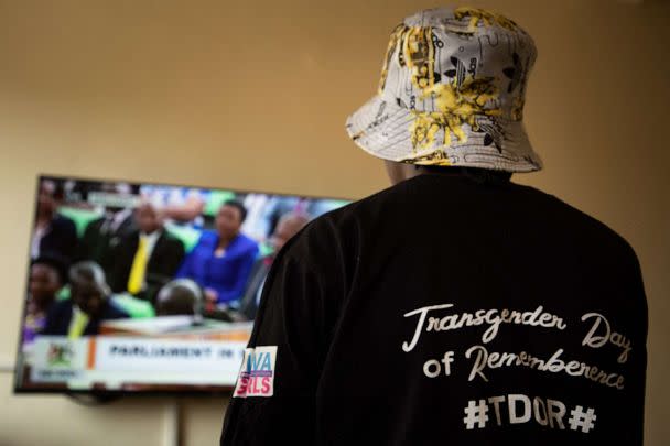 PHOTO: A Ugandan transgender woman watches a TV screen showing the live broadcast of the session from the Parliament for the country's anti-gay bill, near Kampala on March 21, 2023. (Stuart Tibaweswa/AFP via Getty Images)