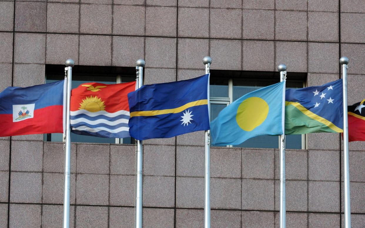 The national flag of Kiribati flies outside the diplomatic quarter in Taipei - REX