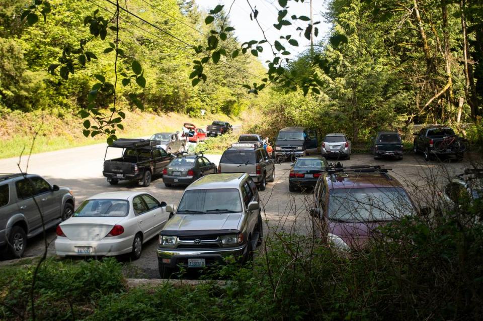 The parking lot near Galbraith Mountain in 2019 caused safety concerns, as vehicles lined up on the shoulder along Samish Way in Bellingham. In May, the Whatcom Mountain Bike Coalition unveiled a 184-stall paved parking lot for the south trailhead after raising $606,000 over five years.