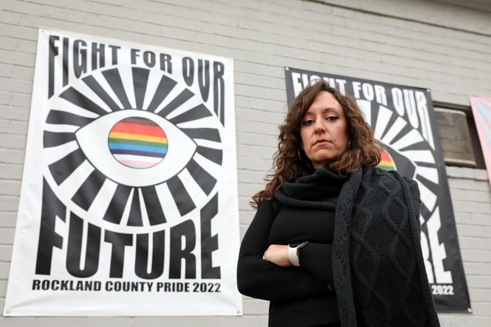 Brooke Malloy, executive director of the Phyllis B. Frank Rockland County Pride Center, stands outside the center hours after anti-gay graffiti was found under the "Fight for Our Future" flags Jan. 11, 2023 in Nyack.