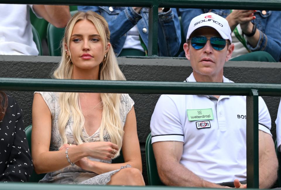 LONDON, ENGLAND - JULY 10: Morgan Riddle and Michael Russell watch Taylor Fritz V Lorenzo Musetti on day ten of the Wimbledon Tennis Championships at the All England Lawn Tennis and Croquet Club on July 10, 2024 in London, England. (Photo by Karwai Tang/WireImage)