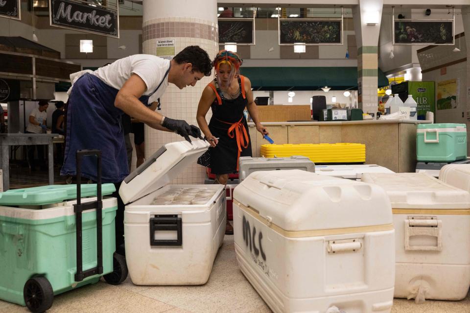 Volunteers prepare free meals to donate to West Maui on 13 August (AFP via Getty Images)