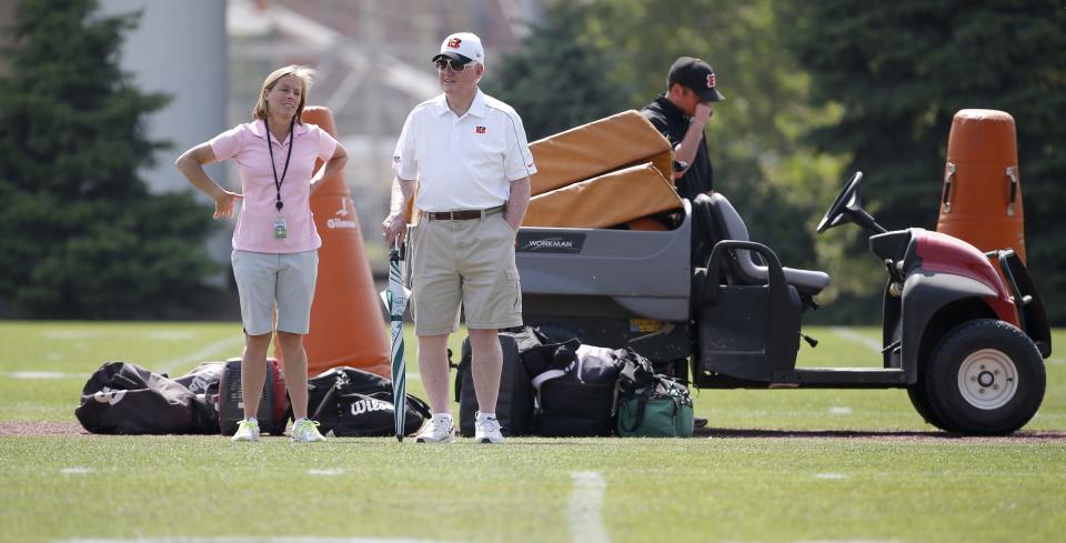 Katie Blackburn, Bengals executive vice president, left, talks with scouting consultant Bill Tobin, during rookie camp in 2015.