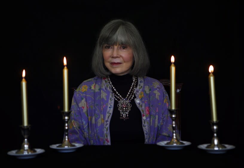 A woman surrounded by candles