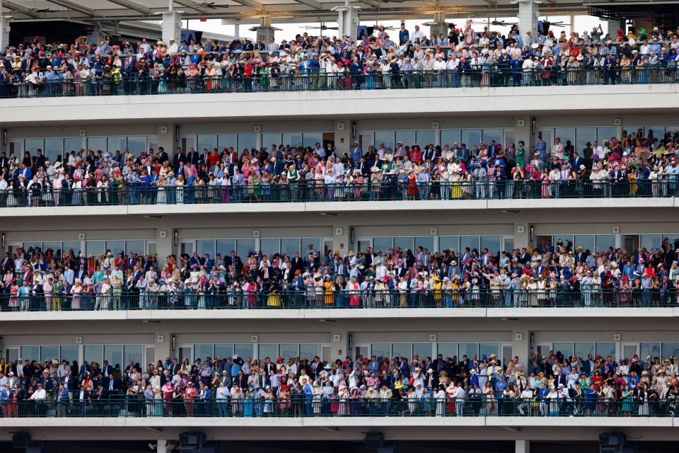 The grandstand crowd waits for the start of the 148th Kentucky Derby on Saturday, May 7, 2022, at Churchill Downs in Louisville, Kentucky.