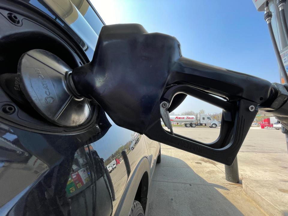 A customer fills up at Kwik Trip, 2900 Holy Hill Rd. in Richfield, Wisconsin on Tuesday, May 10, 2022.